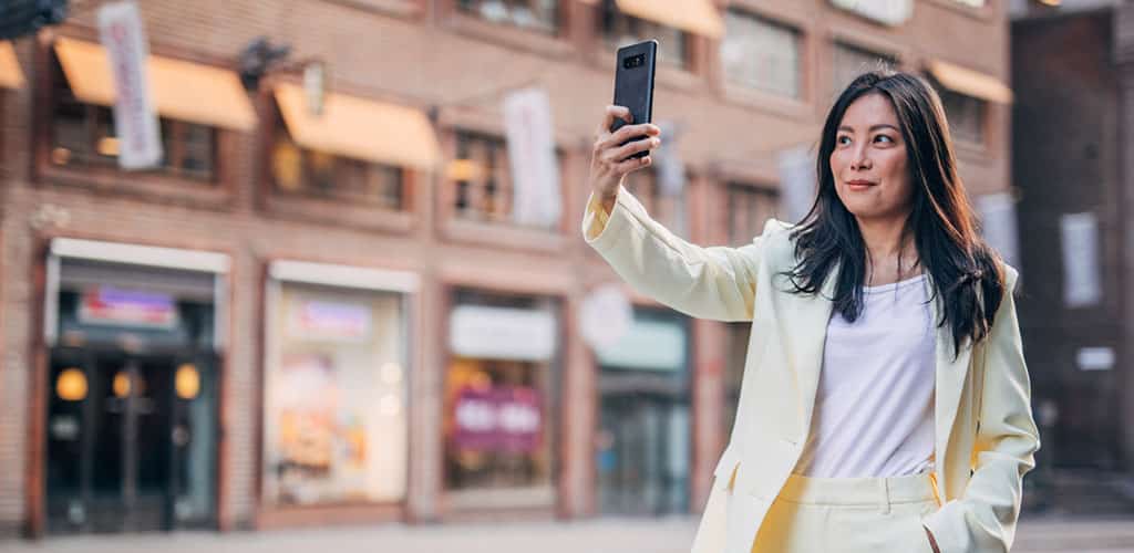 A woman taking a selfie.