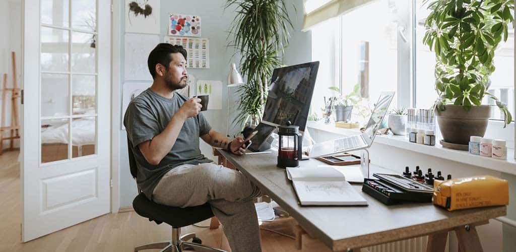 A man in his office at home.