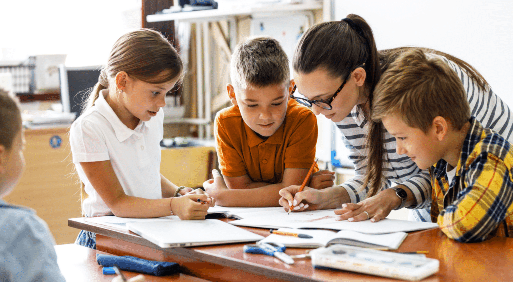 A teacher with students in the classroom.