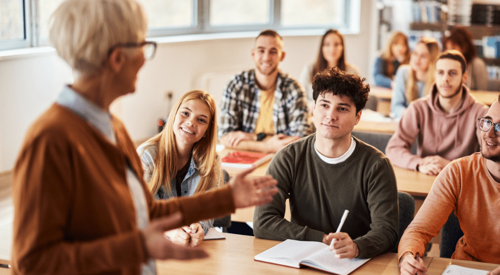 teacher in front of class of high school students