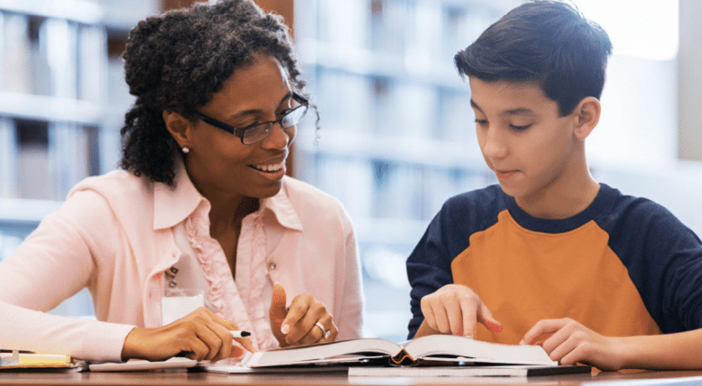 A paraeducator with a student.