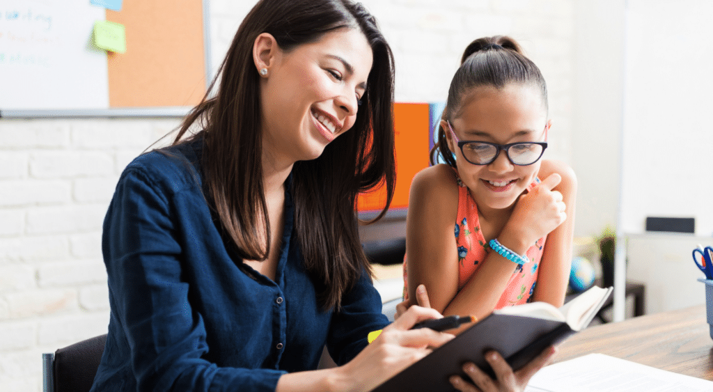 A paraeducator with a student.