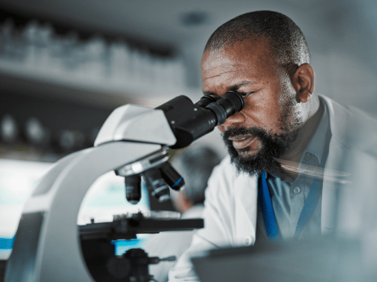 Man looking into a microscope