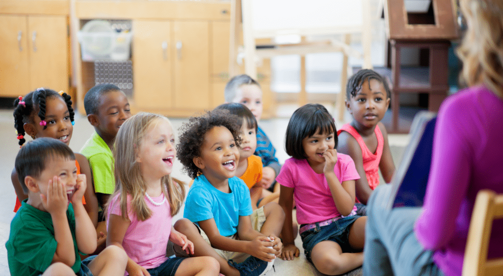 young students listening to substitute teacher