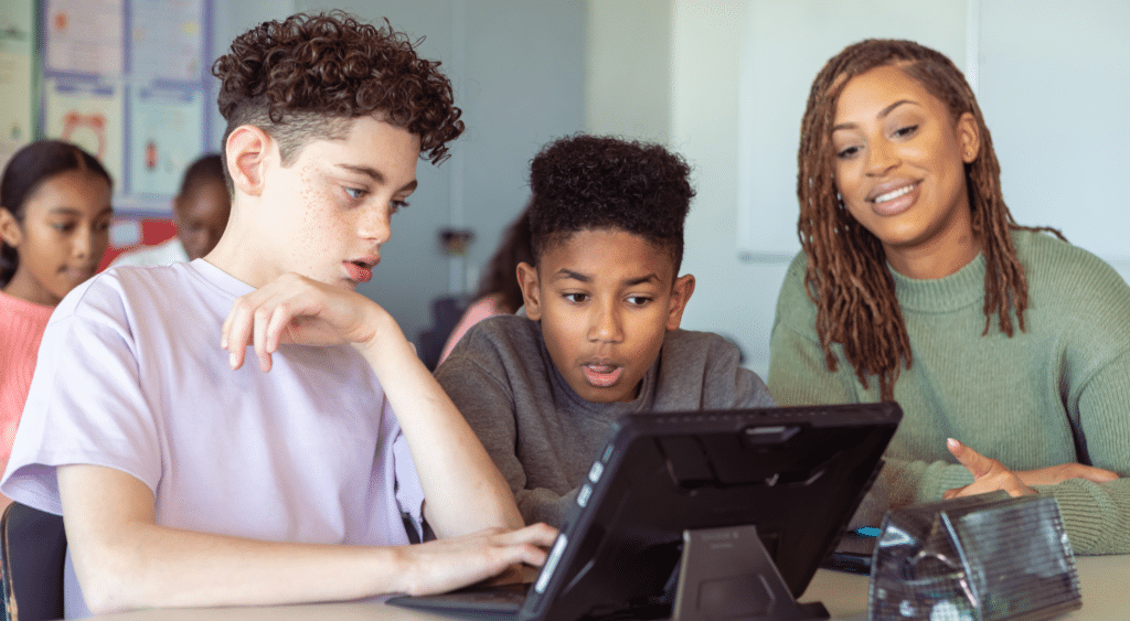 teacher working with classroom technology tablet