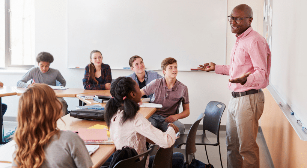 teacher in front of students in classroom